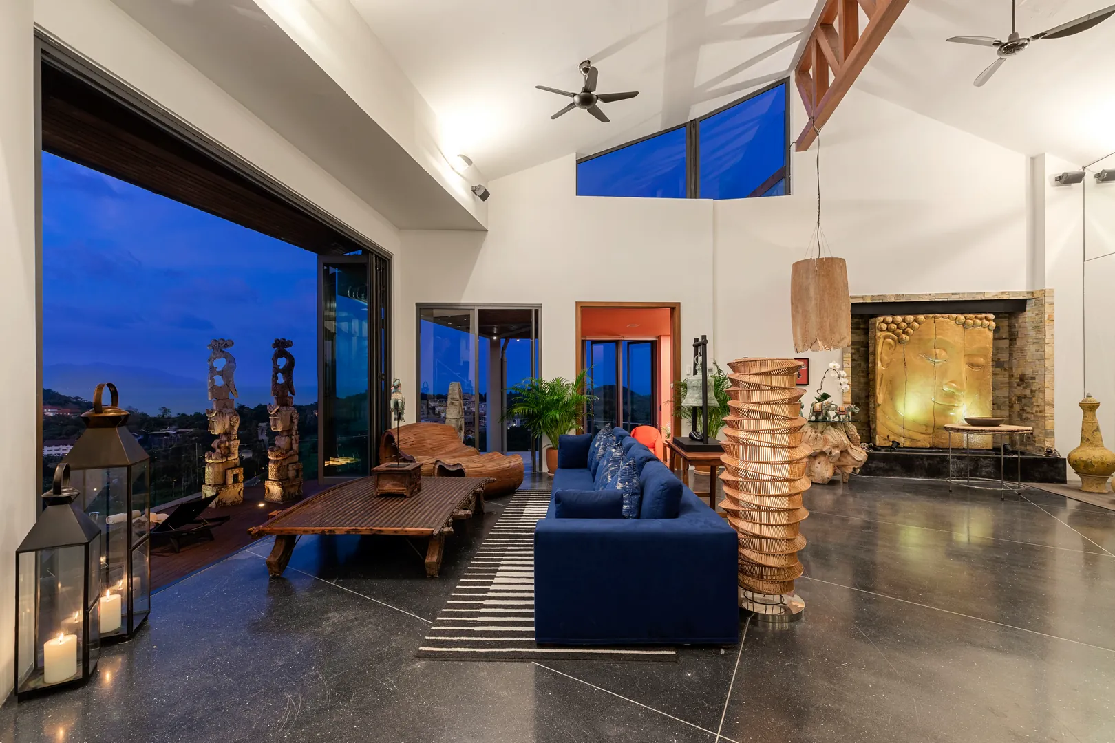 Open-plan living and dining area at Villa Skyfall in the evening