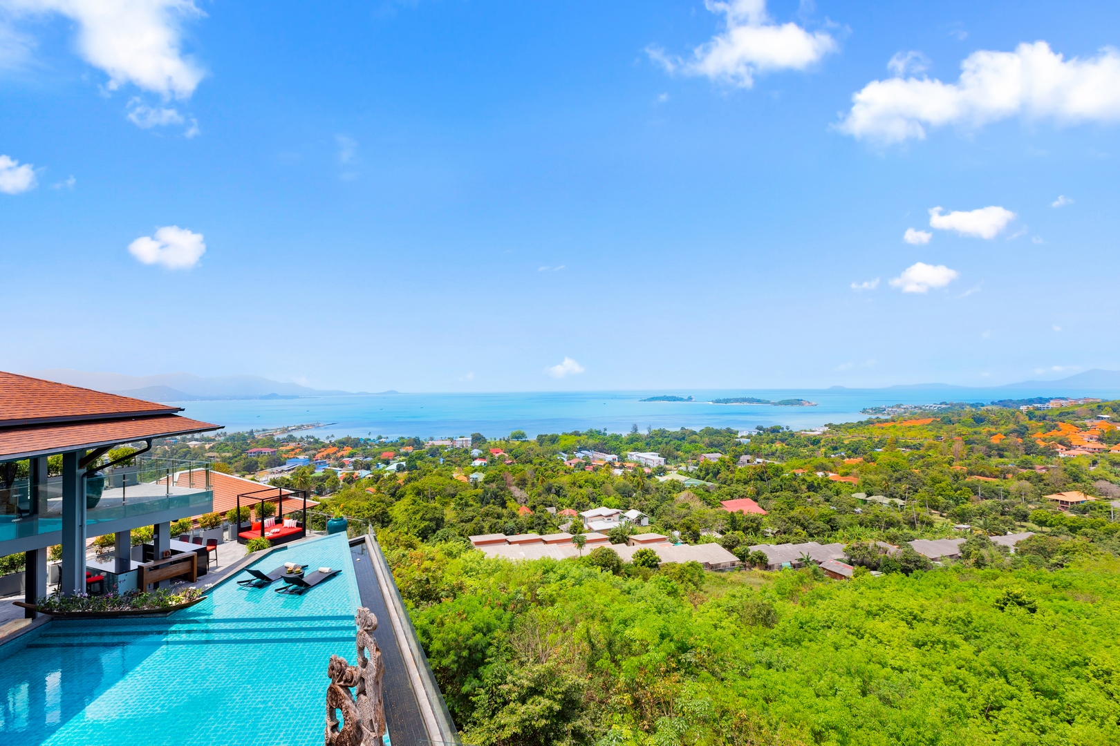 Villa Skyfall infinity pool and surrounding coastline in daylight
